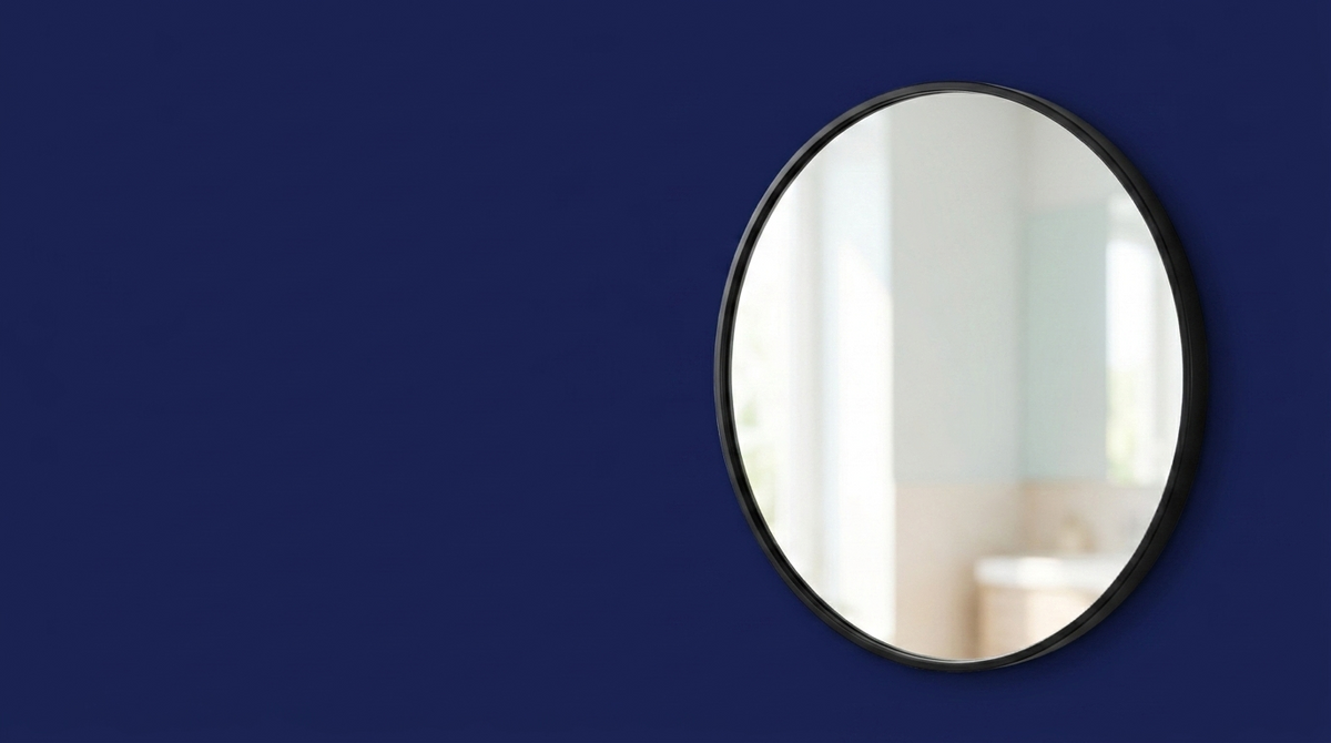 Vanity Mirrors — round black-framed mirror on navy background