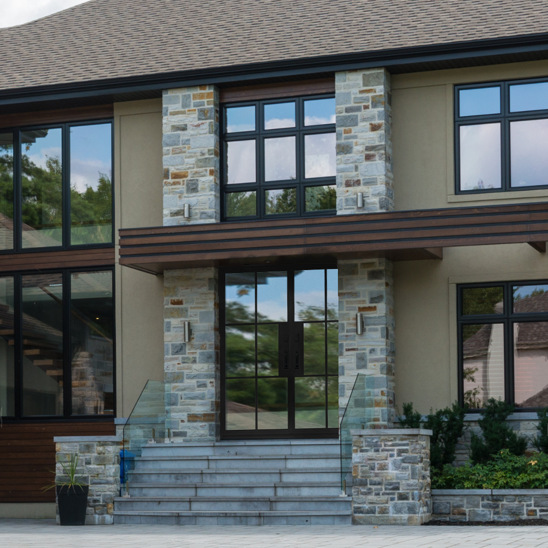 Modern house with stone facade and large windows