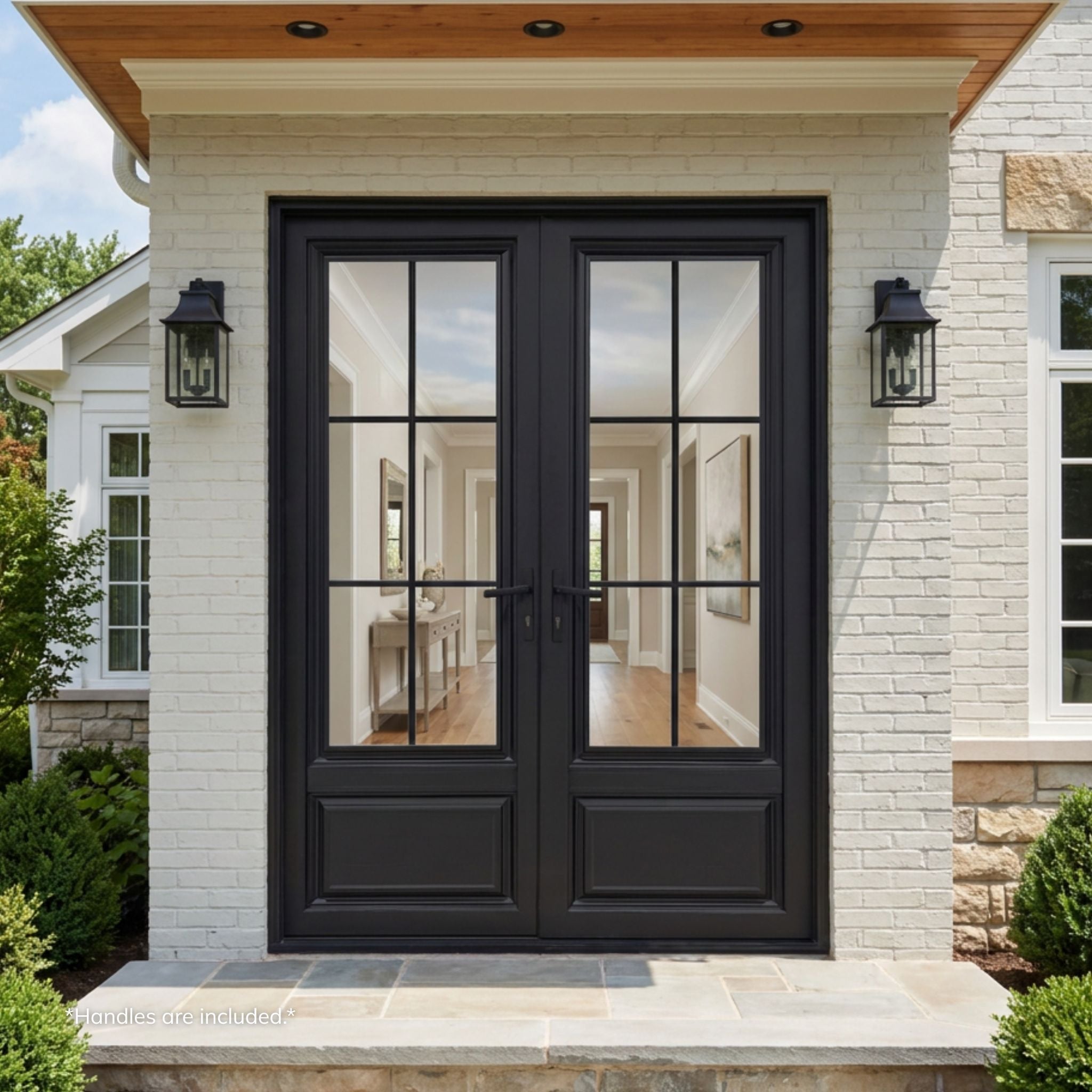 Alexus aluminum 6-lite double entry door, matte black finish with divided-lite clear glass, installed on a white brick home exterior