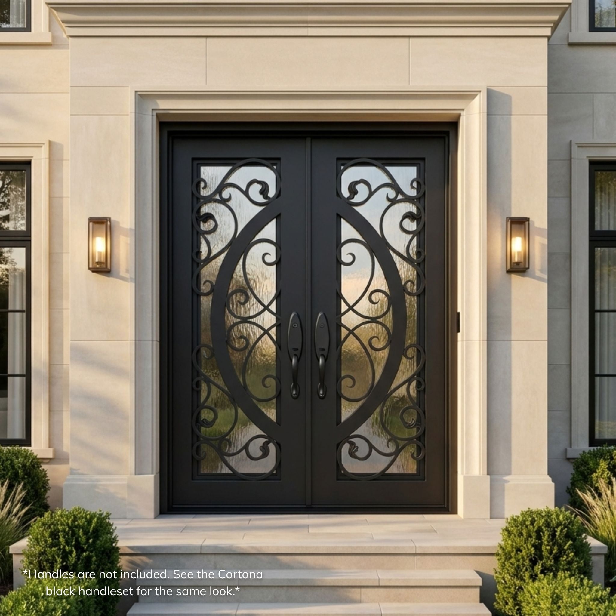 Arthur wrought iron double entry door, matte black finish with scrollwork glass panels and Flemish textured glass, installed on a stone home exterior with lantern sconces
