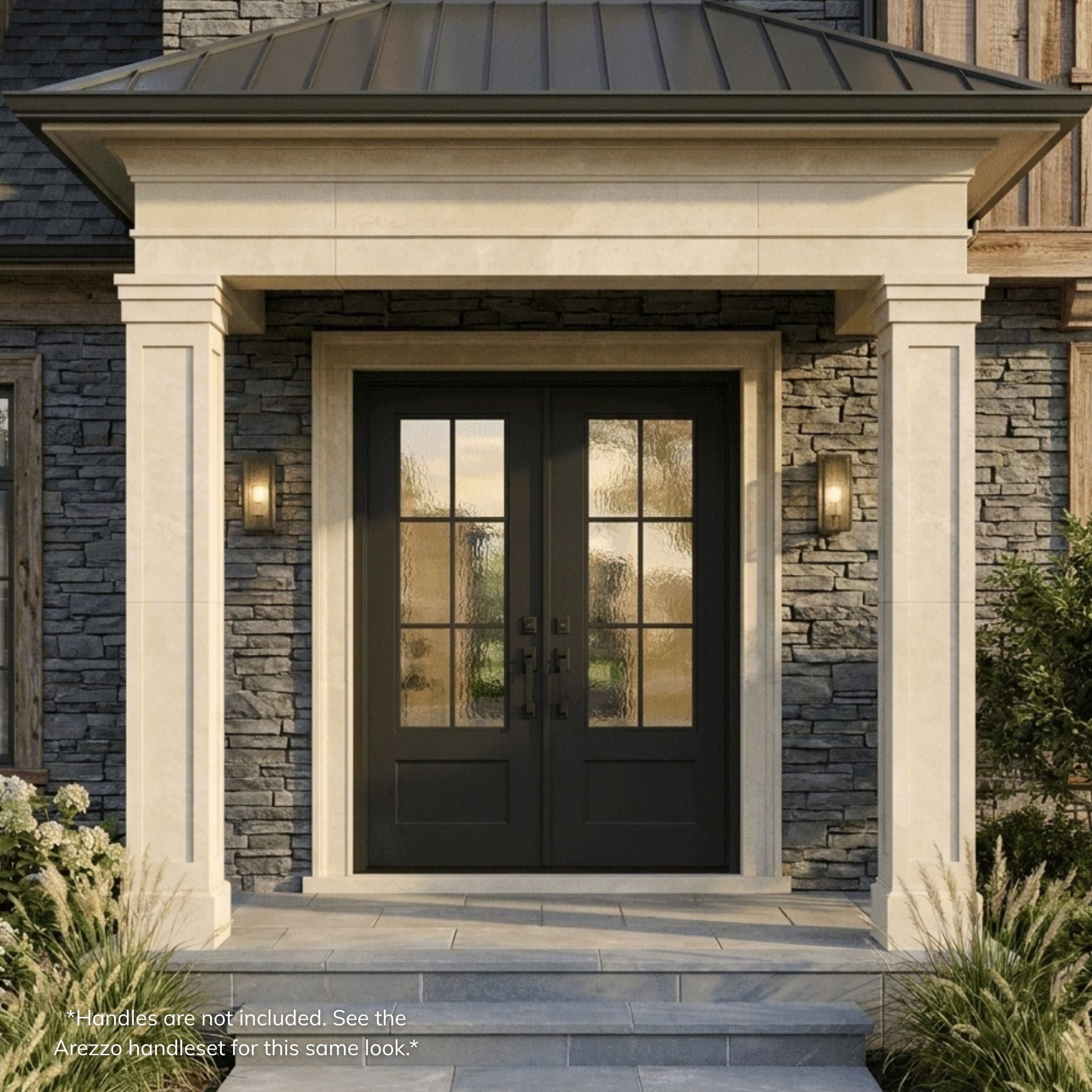 Artigiano wrought iron entry double door with 6-lite Flemish glass, matte black finish, operable glass, installed on a stone home exterior with covered entry