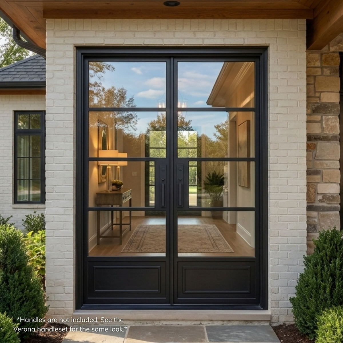 Cellia wrought iron double entry door, matte black finish with horizontal divided-lite clear glass, installed on a white brick home exterior