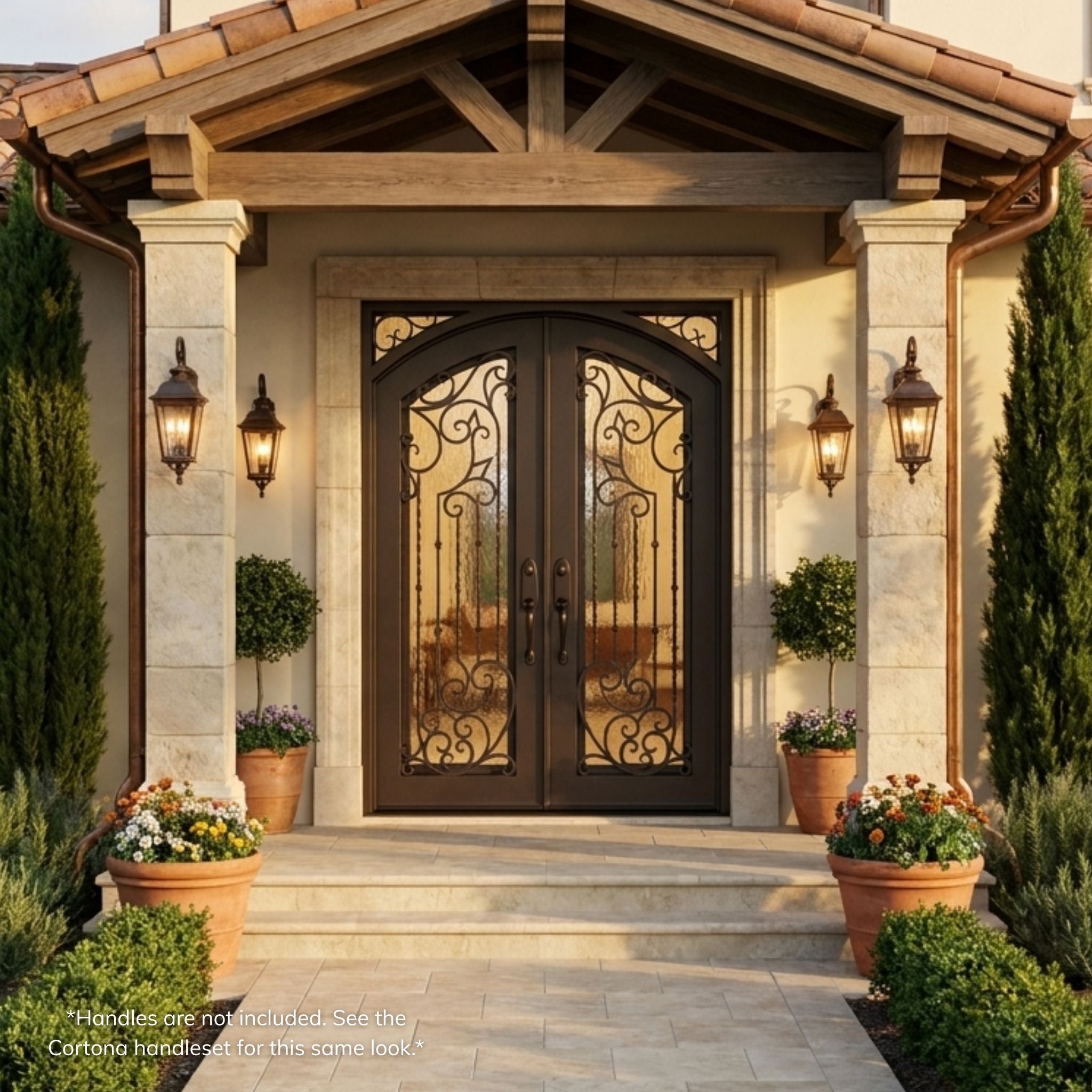 Charles double iron entry door, dark oil rubbed bronze finish with heart-shaped scrollwork glass panels, installed on a home, installed view
