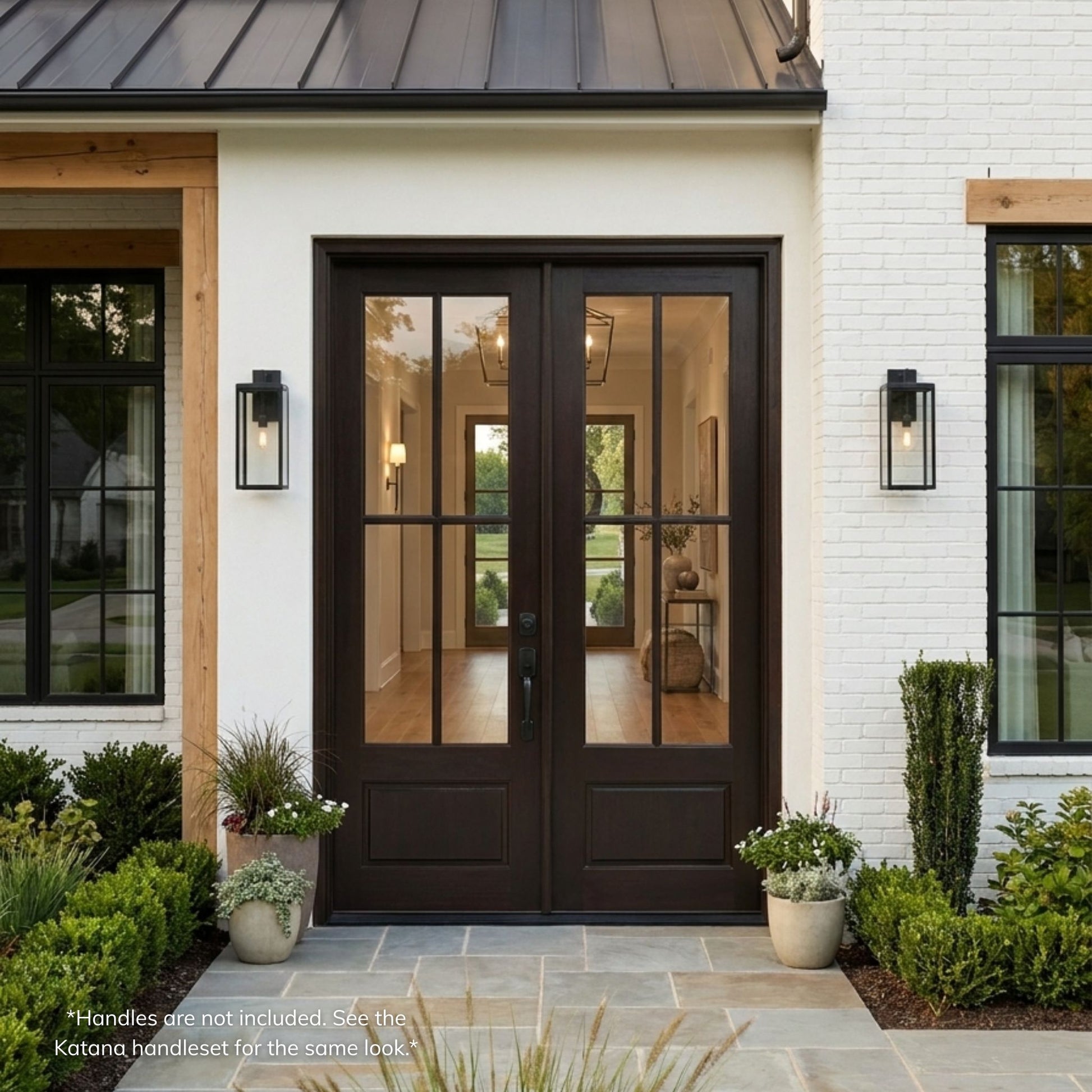 Fiberglass 4-lite SDL double entry door, dark mahogany wood grain finish with clear glass, installed on a white brick modern farmhouse exterior with covered entry