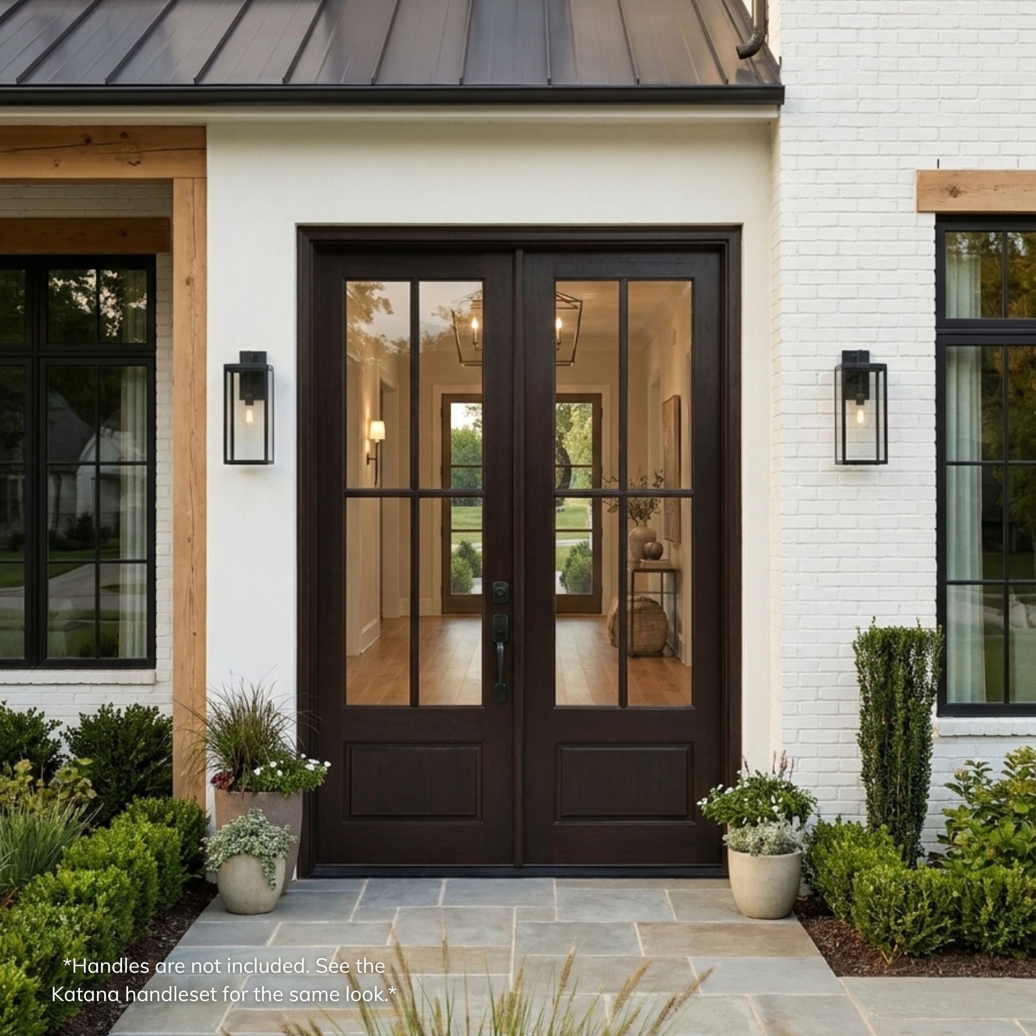 Fiberglass 4-lite SDL double entry door, dark mahogany wood grain finish with clear glass, installed on a white brick modern farmhouse exterior with covered entry