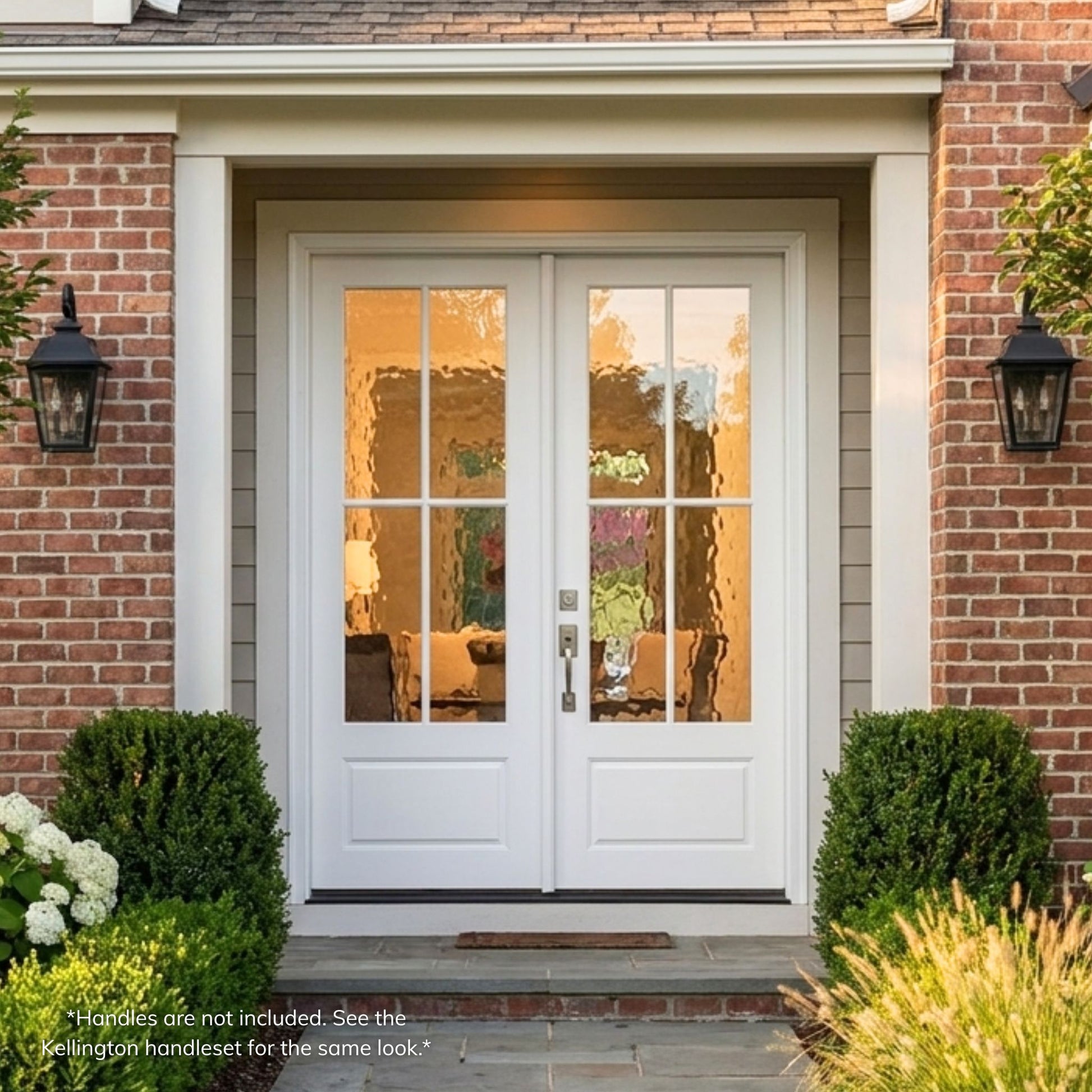Fiberglass 4-lite SDL double entry door, primed white finish with Flemish glass, installed on a red brick home exterior with covered entry