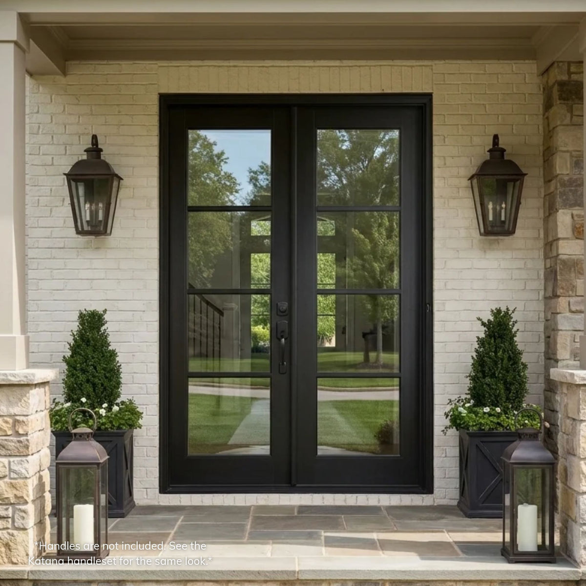 Black fiberglass 4-lite vertical double entry door with full-length clear glass, installed on a painted white brick home with stone columns