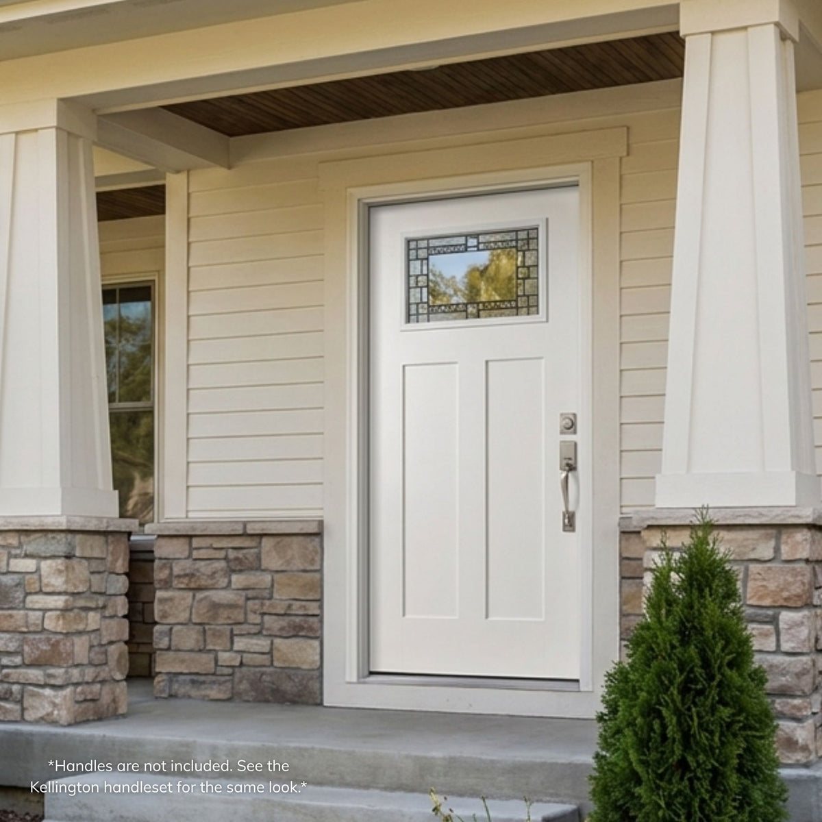 Fiberglass craftsman-style single entry door in a white finish with a small rectangular decorative patina glass lite set into the upper panel, installed on a stone and siding home.