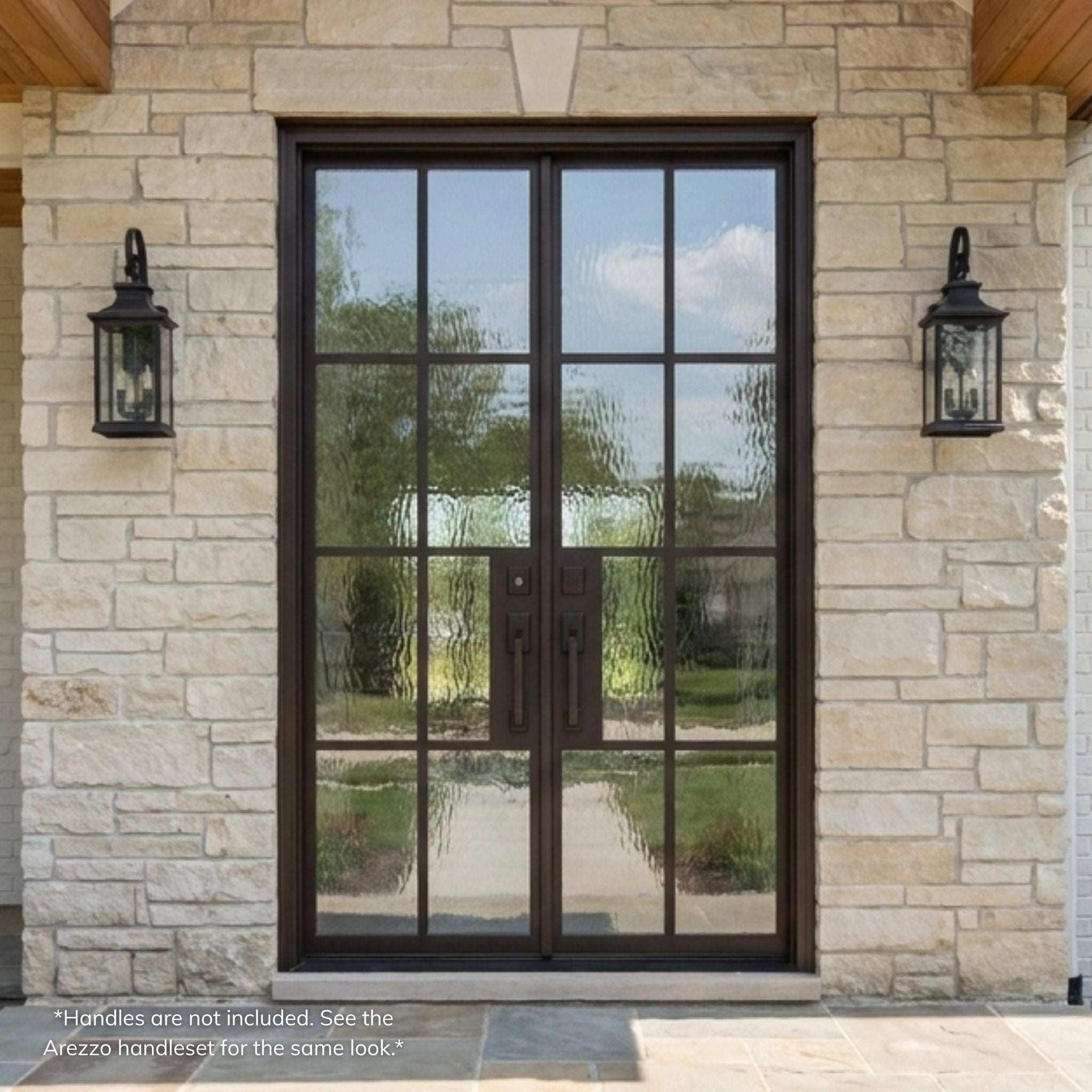George wrought iron double entry door, dark bronze finish with full-view divided-lite glass and Flemish textured glass, installed on a stone home exterior