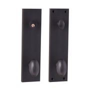Pair of oil rubbed bronze door handles on a white background