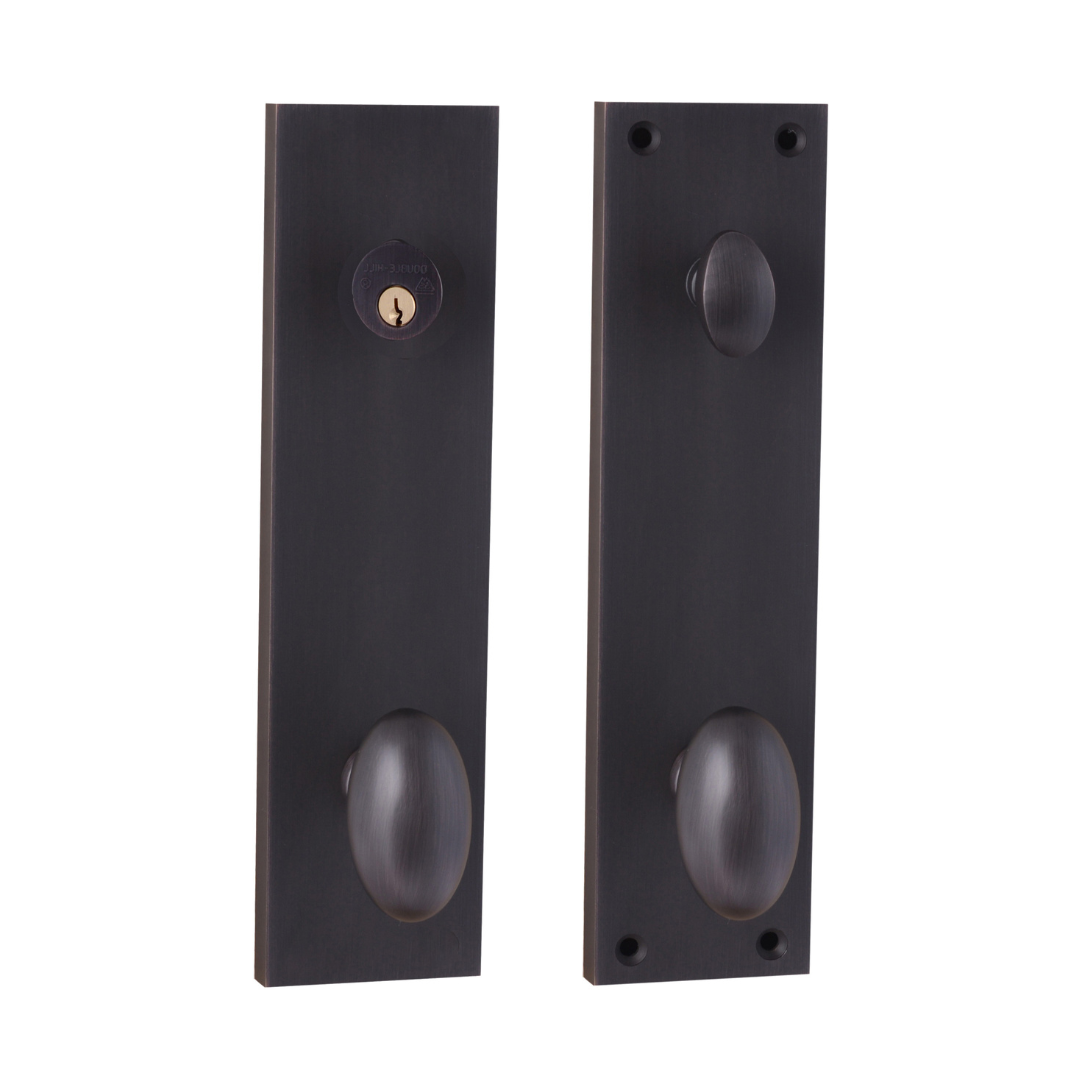 Pair of oil rubbed bronze door handles on a white background