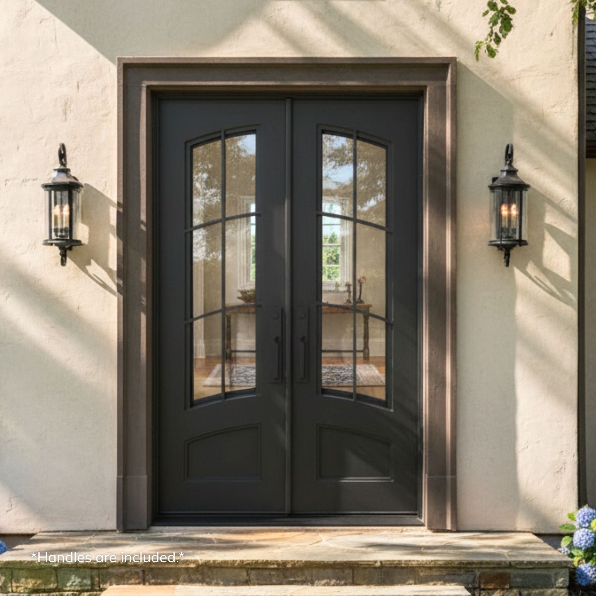 Pinehurst wrought iron double entry door, dark bronze finish with 6-lite eyebrow-top clear operable glass, installed on a stucco home exterior