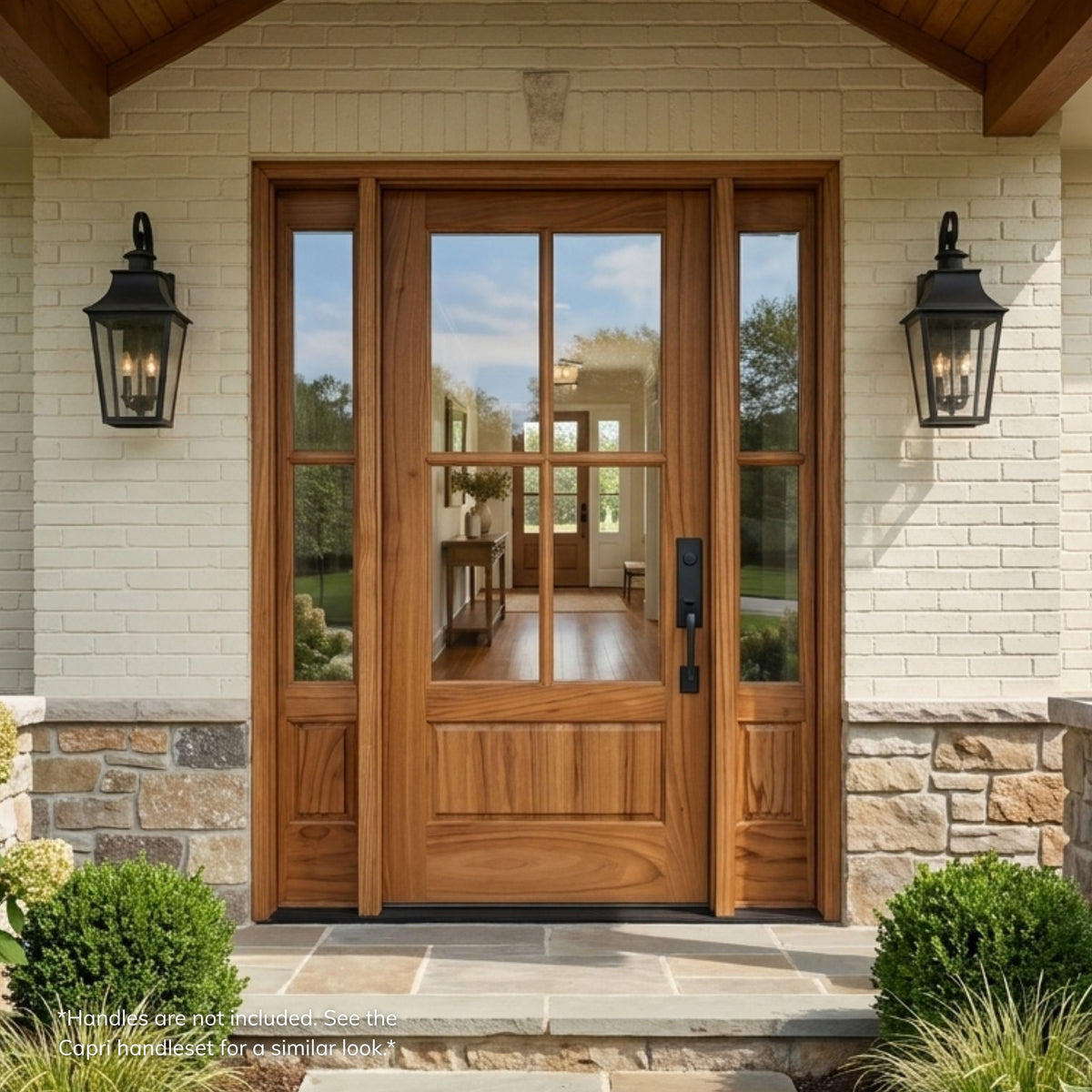 Weathercraft torrefied mahogany single entry door in a natural wood finish with 4-lite clear glass and matching sidelites, installed on a stone and brick craftsman-style home.