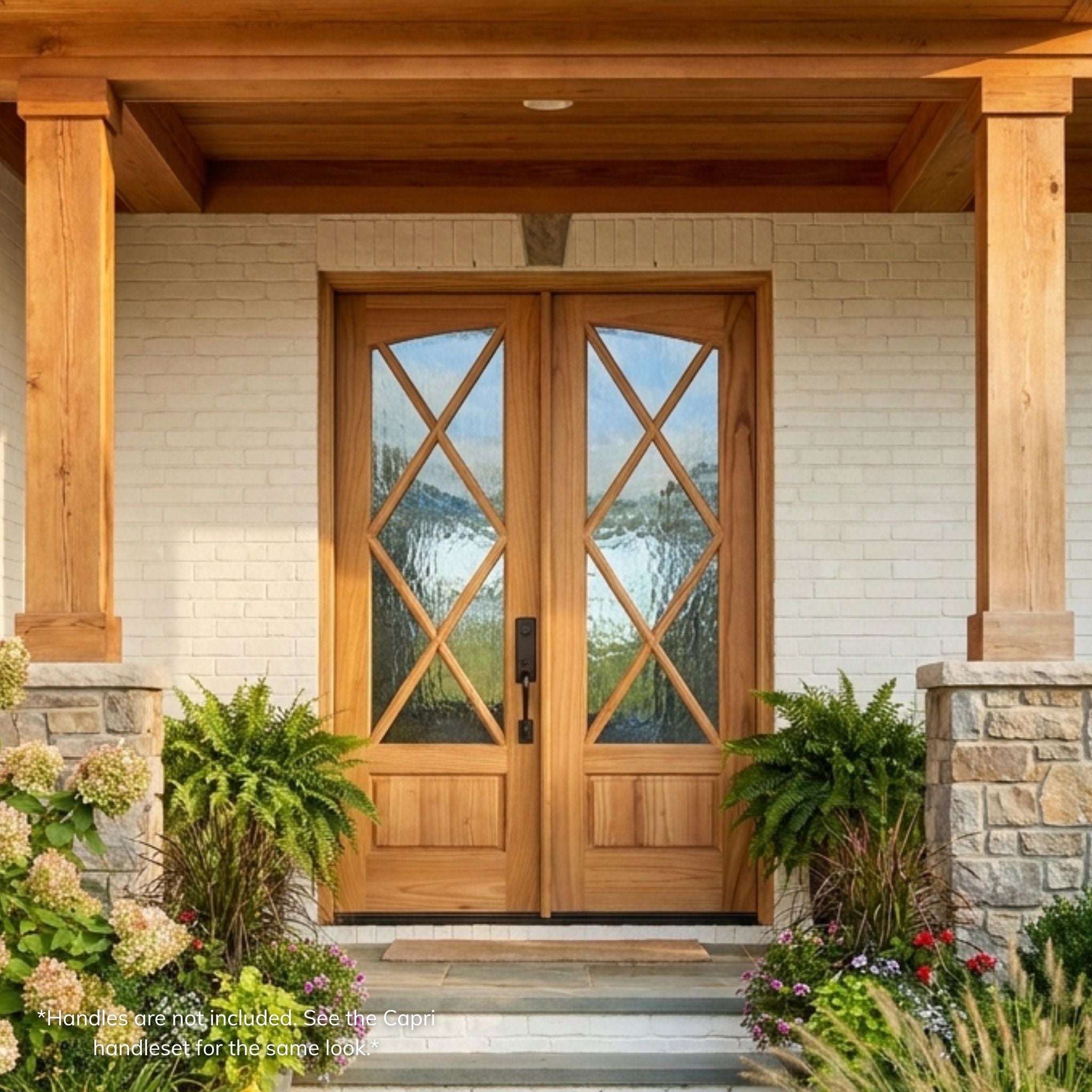 Weathercraft torrefied mahogany double entry door, wood grain finish with X-pattern muntin's and Flemish glass, arch-top design, installed on a craftsman-style stone and brick home exterior