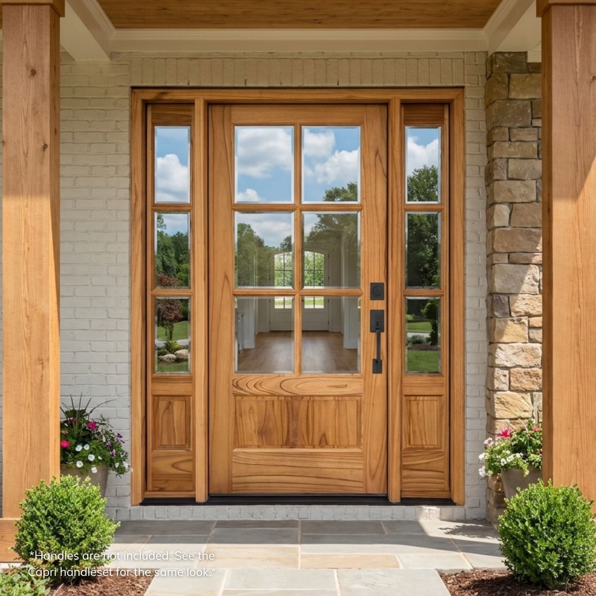 Weathercraft torrefied mahogany 6 lite front entry door with clear glass, matching 3 lite sidelites, natural wood grain, lower raised panels and black handleset on a covered home entry
