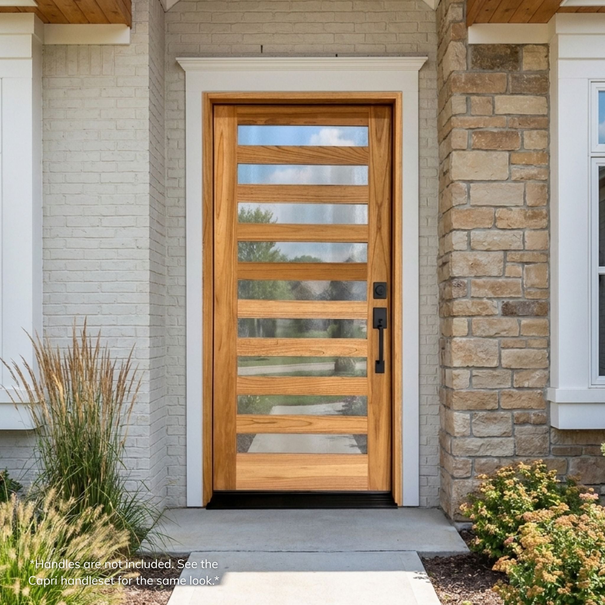 Weathercraft torrefied mahogany 9 lite single entry door with textured chinchilla glass, natural wood grain and black handleset installed on a white brick and stone home exterior